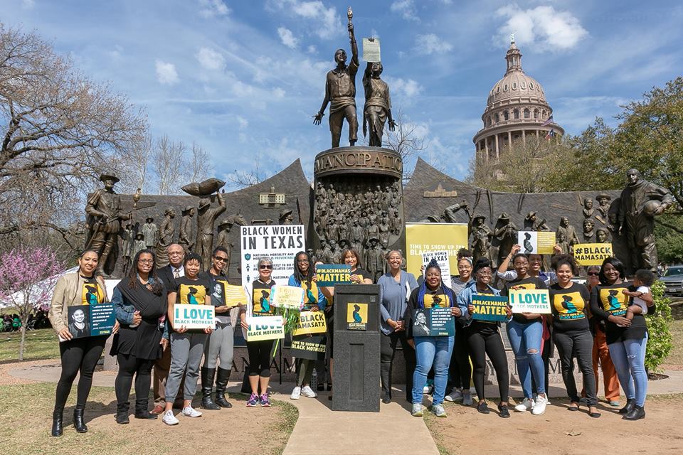 Black Mamas ATX supporters rallied in front of the Texas African-American Memorial statue